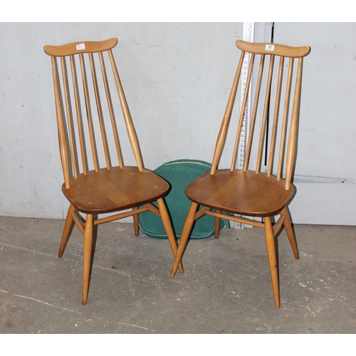 81 - A pair of Ercol Goldsmith pattern dining chairs, blonde finish