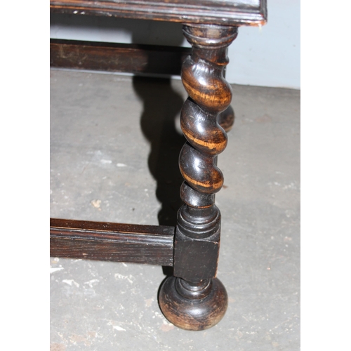 71 - An early 20th century Jacobean style oak sideboard with carved details