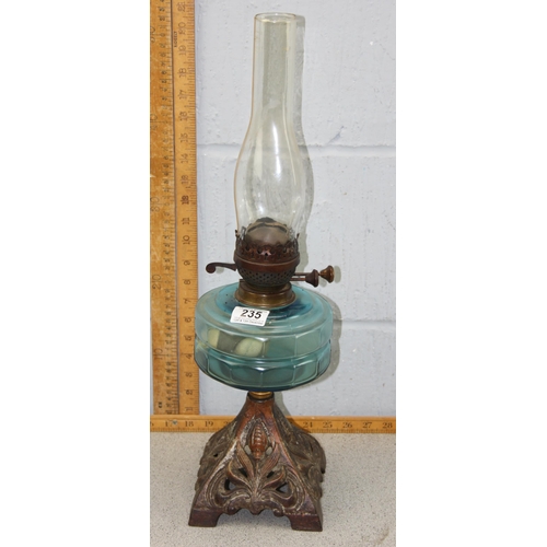 235 - Vintage oil lamp with cast iron base