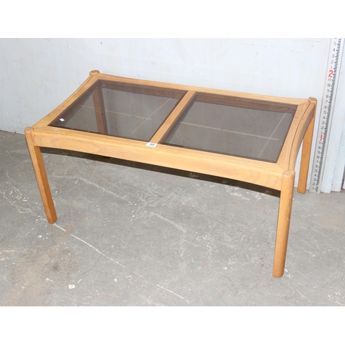 84 - Blonde Ercol coffee table with smoked glass panels