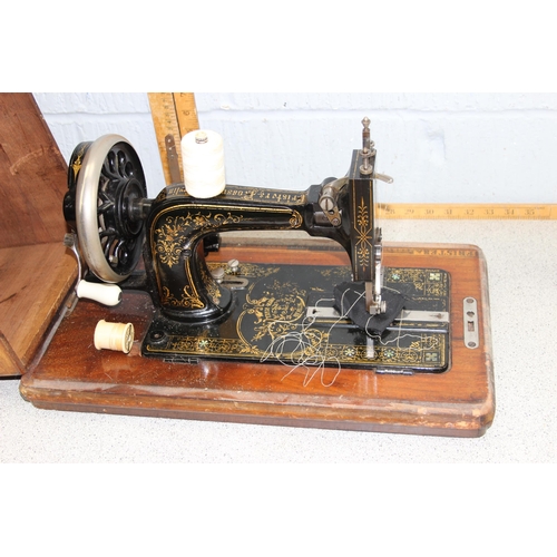 879 - Antique Frister & Rossman sewing machine in wooden case