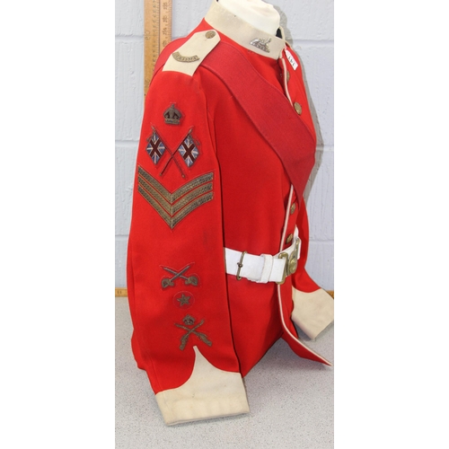 1412 - WWI colour Sergeant tunic to Manchester regiment with original badges and belt, mannequin not includ... 