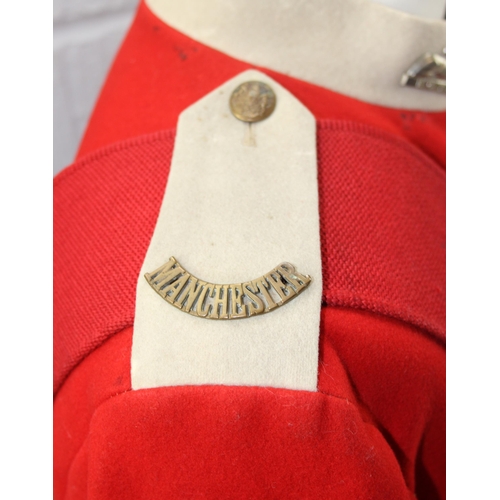 1412 - WWI colour Sergeant tunic to Manchester regiment with original badges and belt, mannequin not includ... 