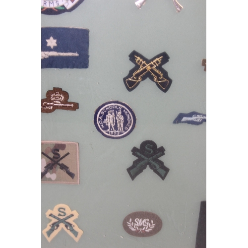 1436 - Glazed display of various shooting patches and badges etc, Small Arms School Sniper Proficiency etc