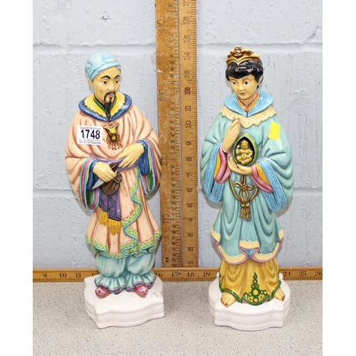 1748 - A pair of hand painted decorative ceramic Oriental immortal figures, approx 40 cm tall