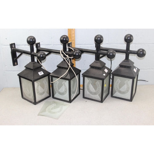 237 - A set of 4 hanging outdoor lamps with horseshoe glass panels