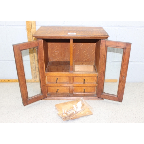 287 - A vintage oak tabletop cabinet with 4 small drawers