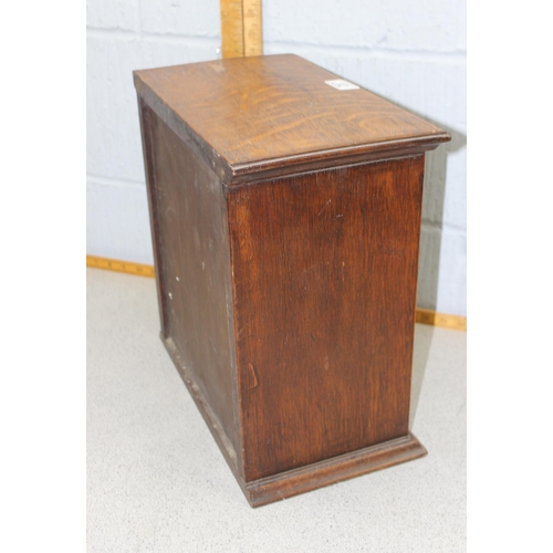 287 - A vintage oak tabletop cabinet with 4 small drawers