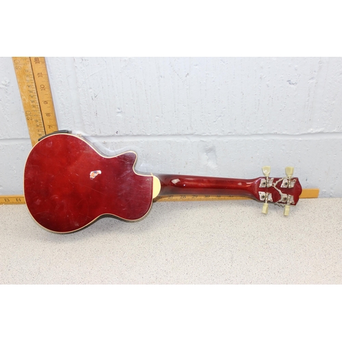 670 - Wooden bodied four string Ukulele and a scale model miniature violin and bow in fitted case. (2 item... 