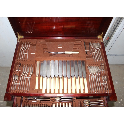 1002 - An extensive early 20th century Mappin & Webb canteen of cutlery in floor standing mahogany box