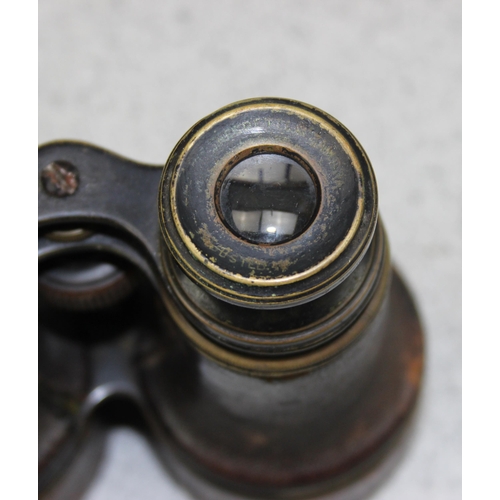 1445 - A pair of Boer War/ WW1 period binoculars in leather case, likely officer's private purchase, by Neg... 