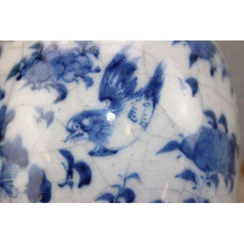 1619 - A Chinese crackle glazed blue and white vase and a Canton famille rose vase (2)