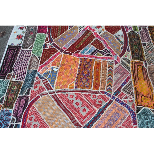 201 - A large Indian Banjara work mirrored wall hanging embroidery, approx 210cm x 160cm