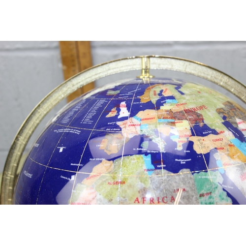 718 - A large gemstone globe on stand, approx 30cm diameter