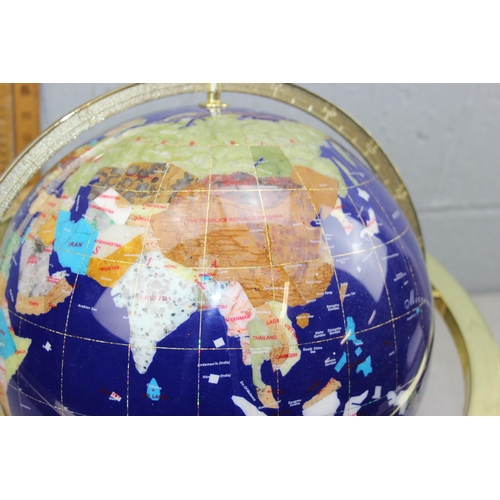 718 - A large gemstone globe on stand, approx 30cm diameter