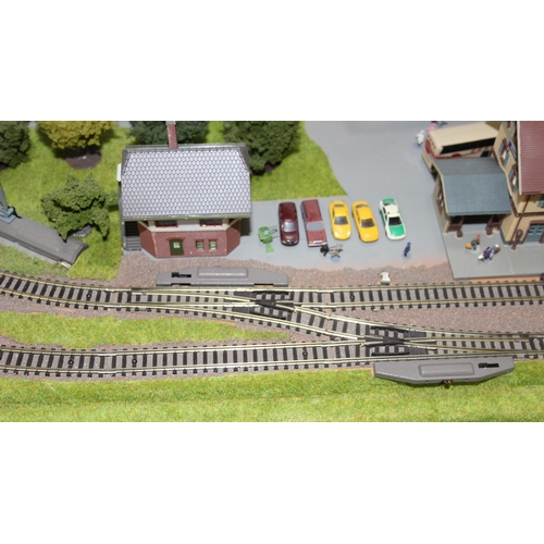 1539 - A large professionally commissioned Fleischmann N gauge track and landscape layout, approx 127cm x 9... 