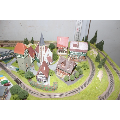 1539 - A large professionally commissioned Fleischmann N gauge track and landscape layout, approx 127cm x 9... 