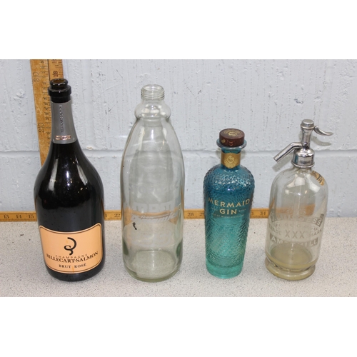 1765 - Quantity of bottles to include antique wine bottle, soda syphon, & Mermaid gin bottles