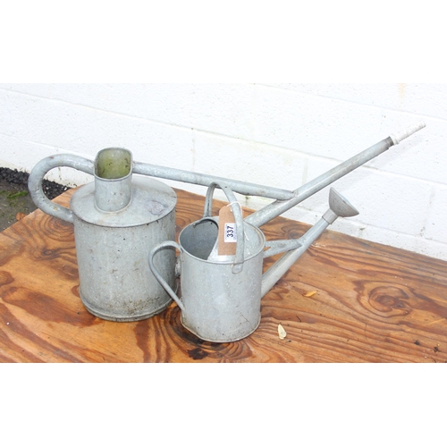 337 - 2 galvanised watering cans one with its rose