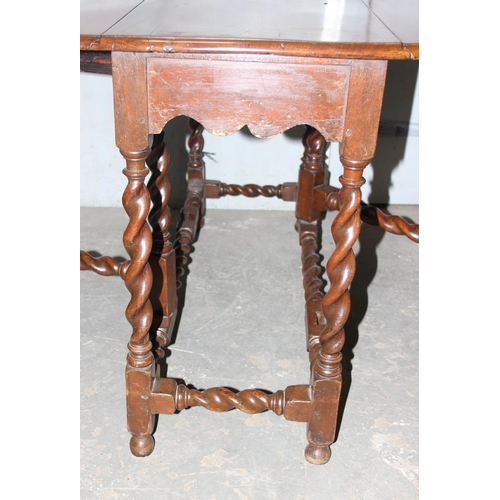 110 - An antique gateleg dropleaf table with barleytwist legs