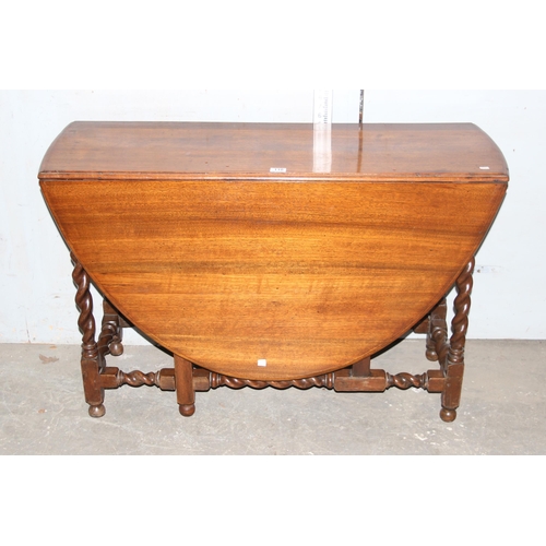 110 - An antique gateleg dropleaf table with barleytwist legs