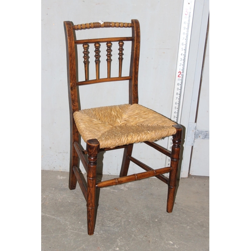 112 - A set of 6 Arts & Crafts period rush seated chairs with bobbin turned back and bamboo effect stretch... 