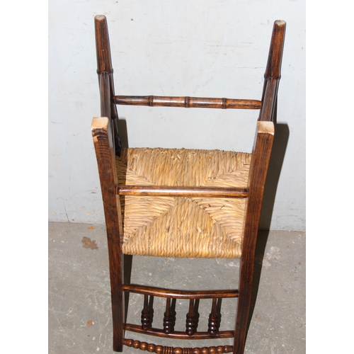 112 - A set of 6 Arts & Crafts period rush seated chairs with bobbin turned back and bamboo effect stretch... 