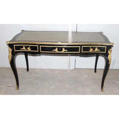 120 - Louis XV style ebonised and gilt leather topped desk