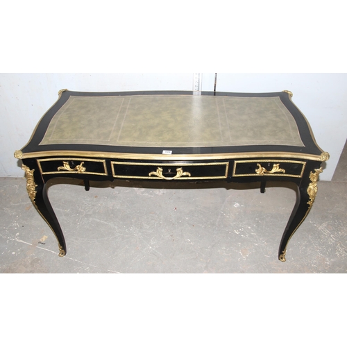 120 - Louis XV style ebonised and gilt leather topped desk