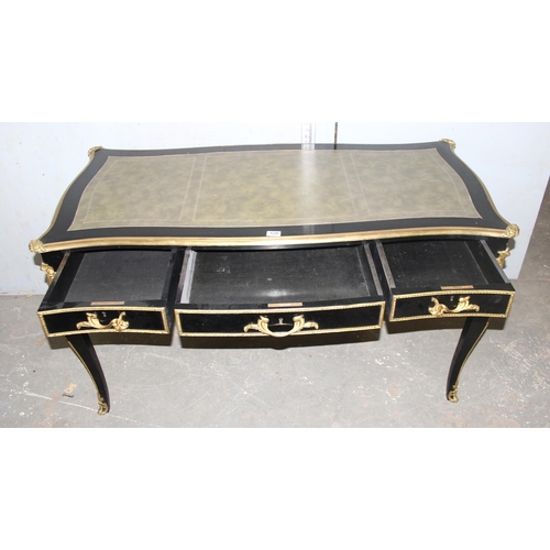 120 - Louis XV style ebonised and gilt leather topped desk