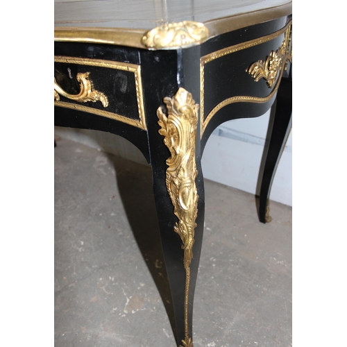 120 - Louis XV style ebonised and gilt leather topped desk