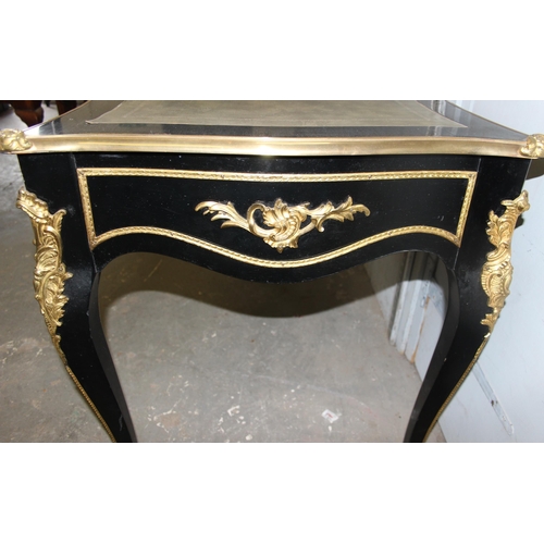 120 - Louis XV style ebonised and gilt leather topped desk