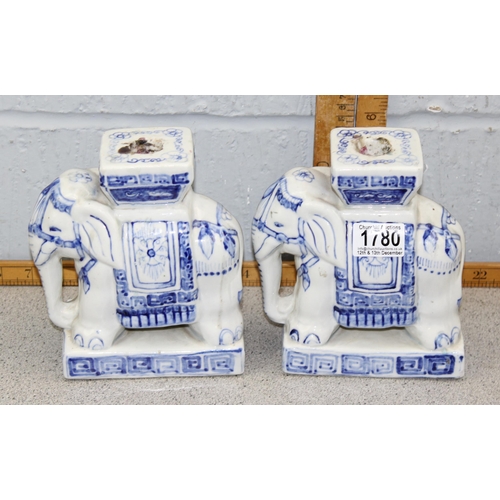 1780 - A pair of blue and white glazed pottery elephant formed candlesticks