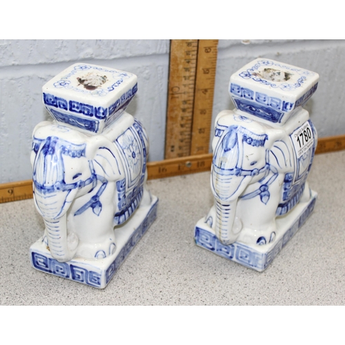 1780 - A pair of blue and white glazed pottery elephant formed candlesticks