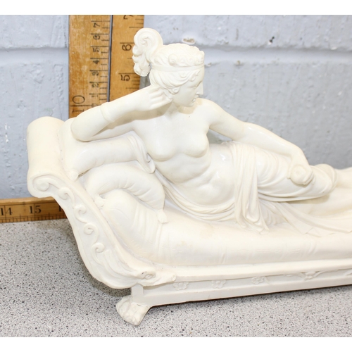 1791 - An antique style figure of a recumbent nude lady on a chaises longue