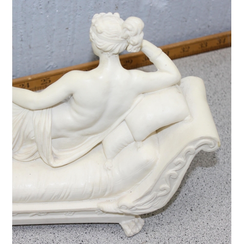 1791 - An antique style figure of a recumbent nude lady on a chaises longue