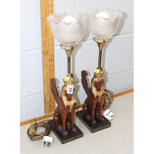 254 - Pair of Egyptian Sphinx style lamps with glass shades