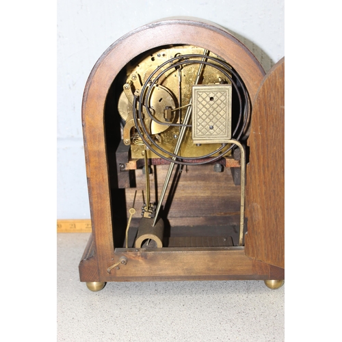 1318 - An antique slate cased mantel clock and another with wooden case and silvered dial (2)