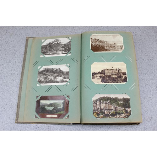 586 - Early 20th century postcard album and contents