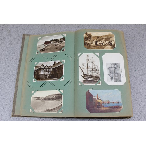 586 - Early 20th century postcard album and contents