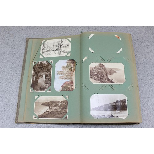 586 - Early 20th century postcard album and contents