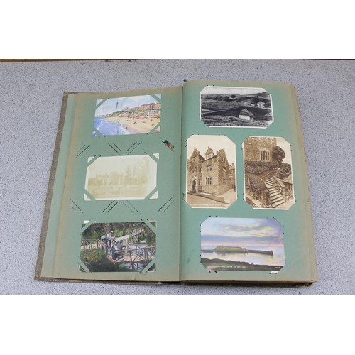 586 - Early 20th century postcard album and contents