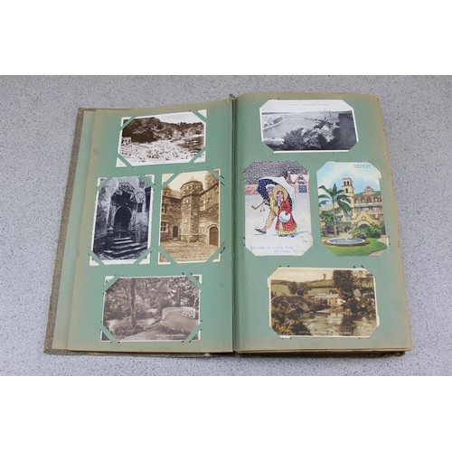 586 - Early 20th century postcard album and contents