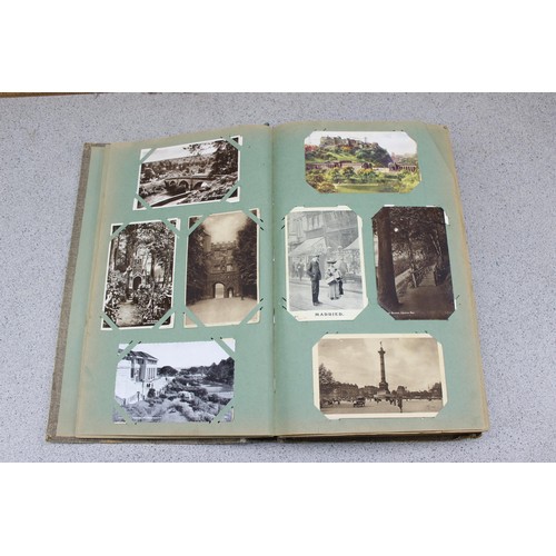 586 - Early 20th century postcard album and contents