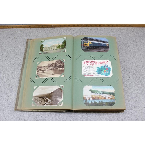 586 - Early 20th century postcard album and contents