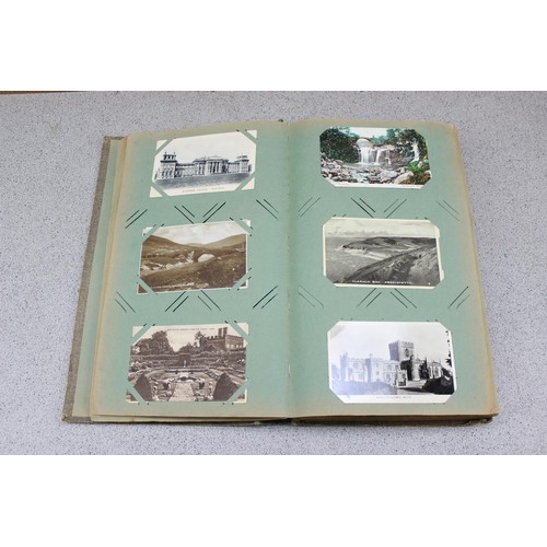 586 - Early 20th century postcard album and contents