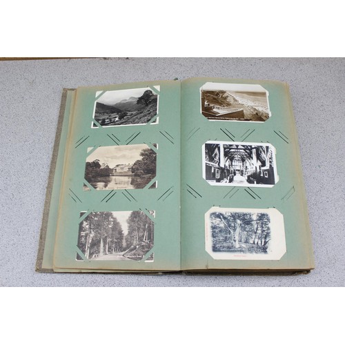 586 - Early 20th century postcard album and contents