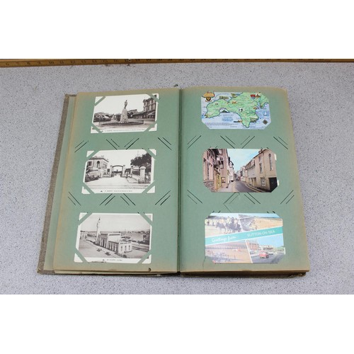 586 - Early 20th century postcard album and contents