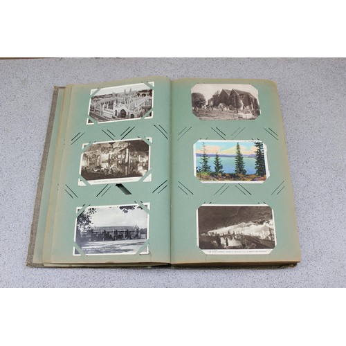 586 - Early 20th century postcard album and contents