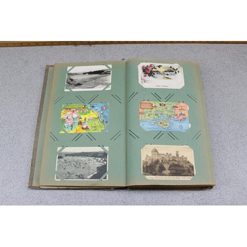 586 - Early 20th century postcard album and contents